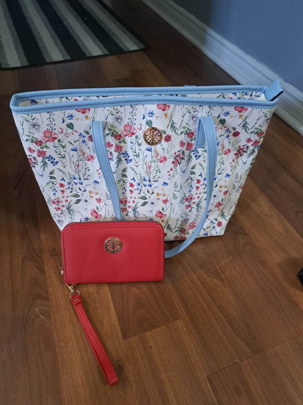 Elegant Floral Print Tote with Light Blue Trim and Red Wristlet